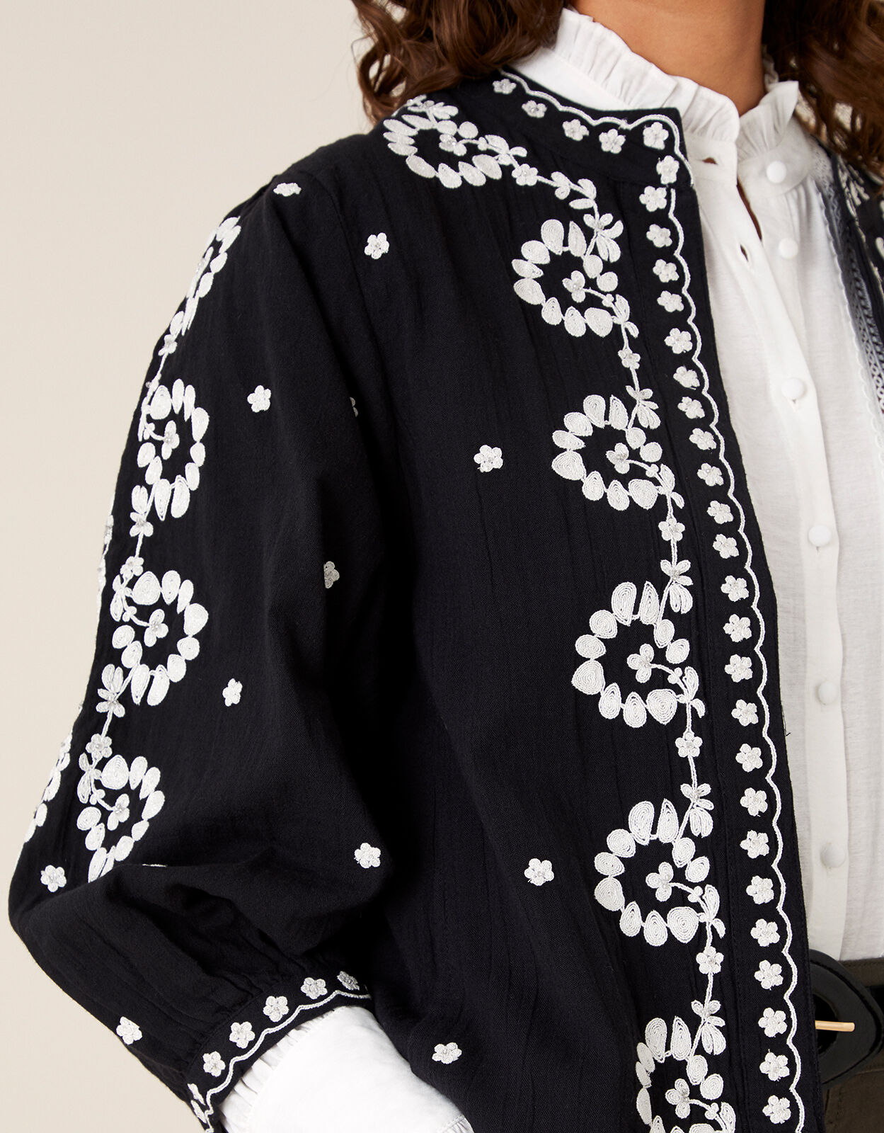 Black coat with embroidered flowers top