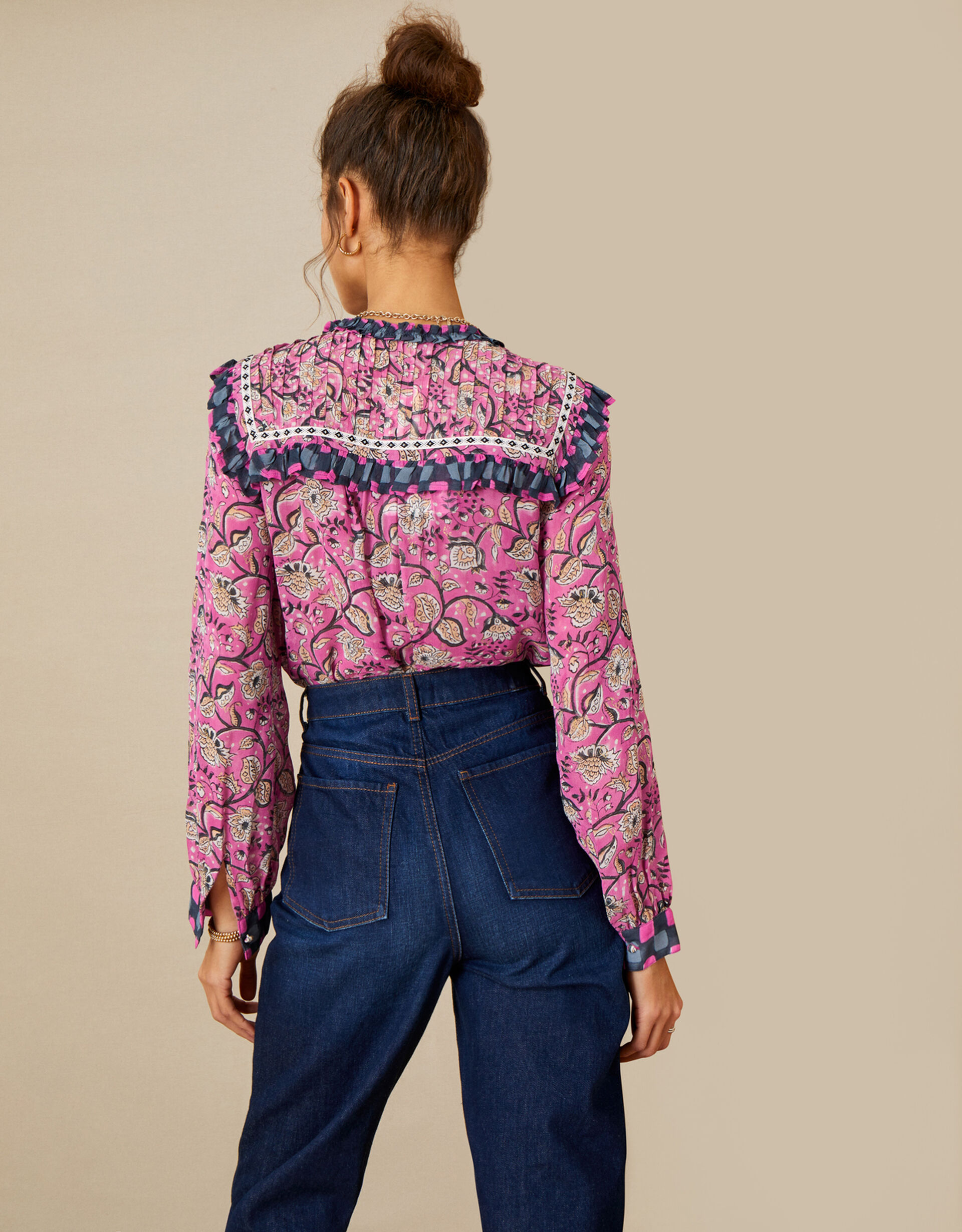 mustard blouse with pink floral pattern