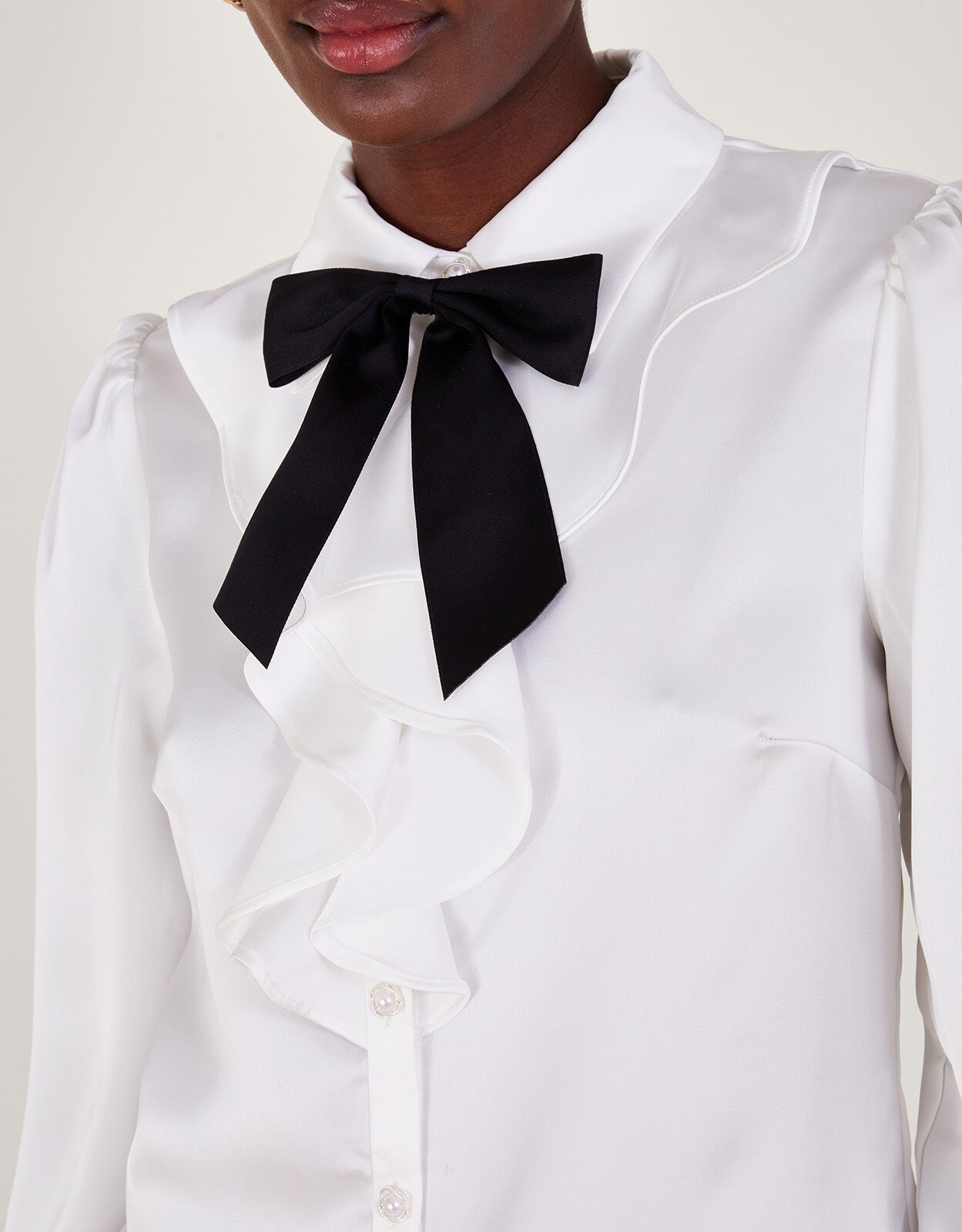 white silk blouse with a frill
