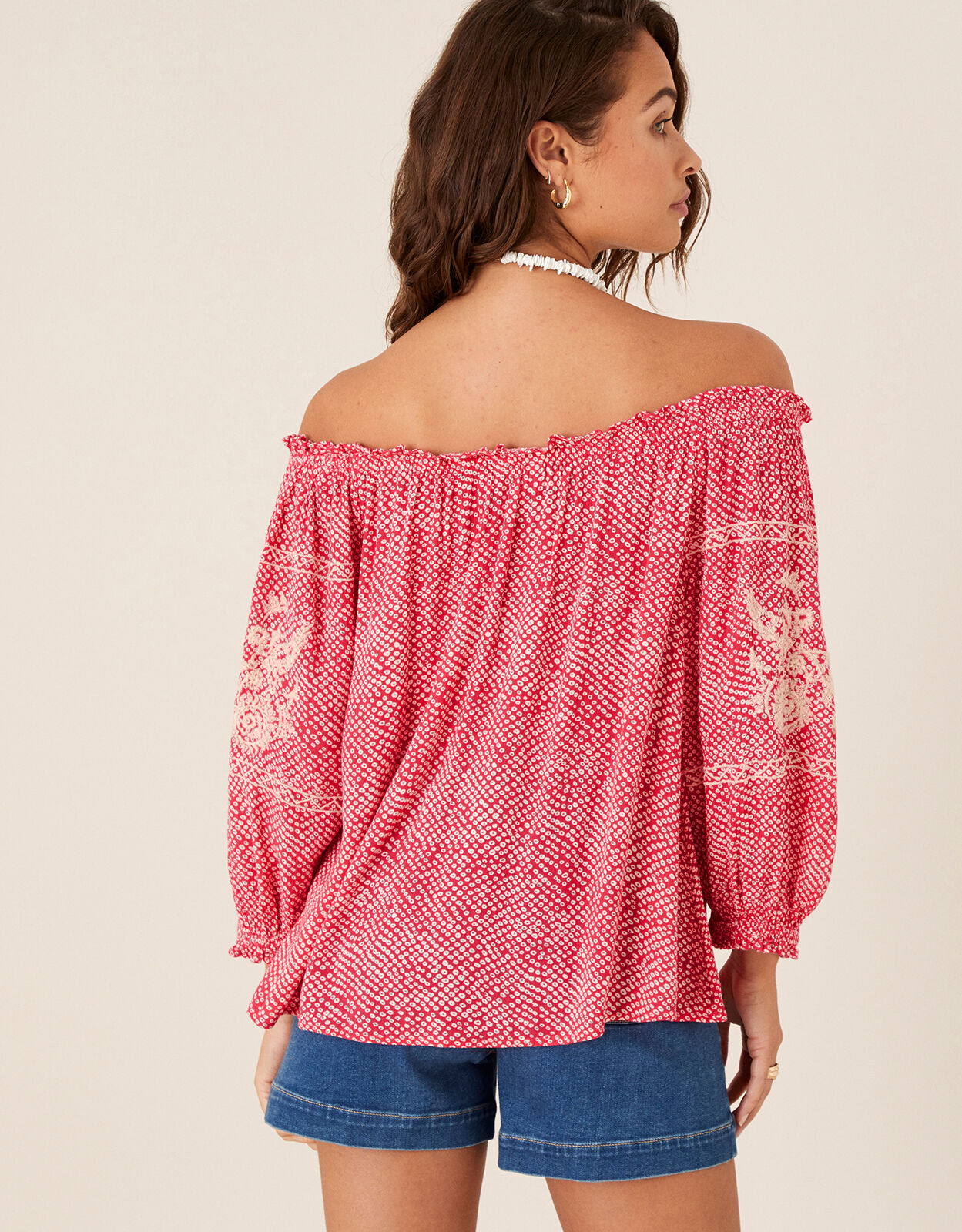 pink shoulderless top