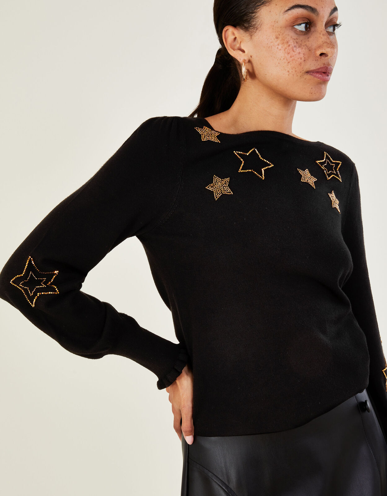 Black jumper with stars 2025